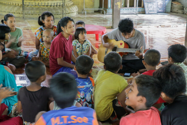 Playing Guitar for IDPs Children.